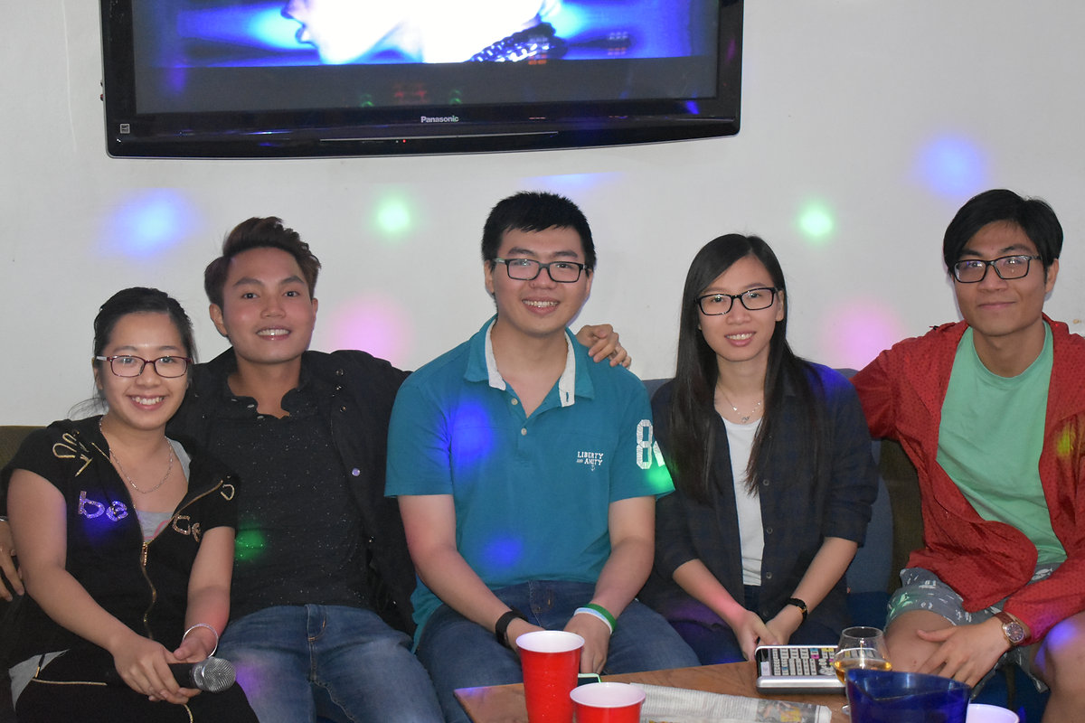 Guests celebrating in a karaoke room
